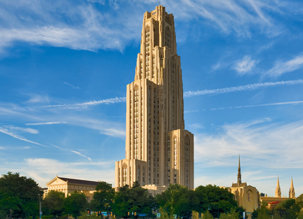 Recent image of the cathedral of learning, a 40 story tower at Pitt State on a sunny day. 