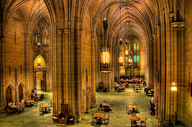 Interior of the Cathedral of Learning. Large, arched interior halls with tables scattered about. 